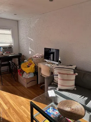 a kitchen with stainless steel appliances a stove a sink and a microwave