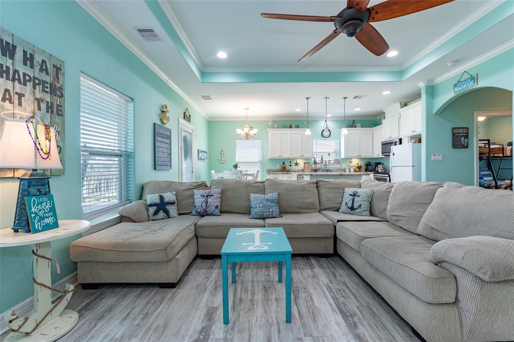 987 Surf Crystal Beach Crystal Beach, TX 77650 - Photo 16 of 45 a living room with furniture and a large window