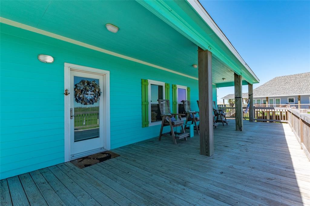 987 Surf Crystal Beach Crystal Beach, TX 77650 - Photo 26 of 45 a view of dining room with wooden floor