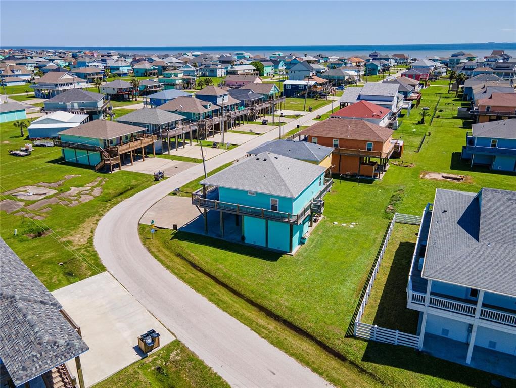 987 Surf Crystal Beach Crystal Beach, TX 77650 - Photo 3 of 45 an aerial view of a house with a garden