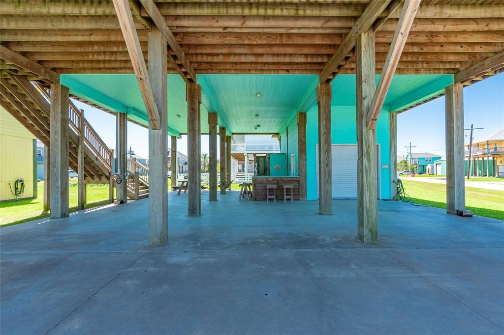 987 Surf Crystal Beach Crystal Beach, TX 77650 - Photo 32 of 45 a view of porch with a table and chairs