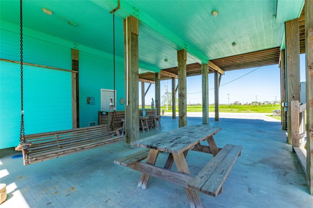 987 Surf Crystal Beach Crystal Beach, TX 77650 - Photo 37 of 45 a view of a patio with a table and chairs