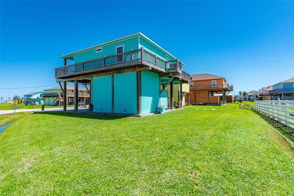 987 Surf Crystal Beach Crystal Beach, TX 77650 - Photo 40 of 45 a front view of a house with garden
