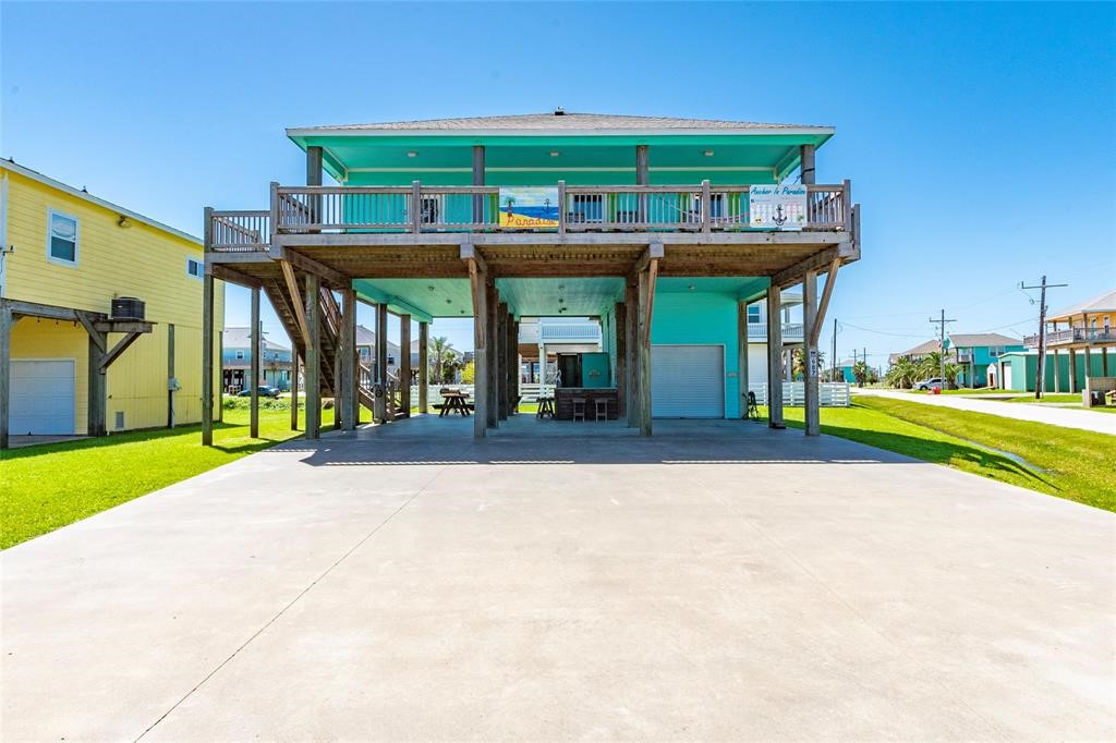 987 Surf Crystal Beach Crystal Beach, TX 77650 - Photo 4 of 45 a view of a house with a swimming pool