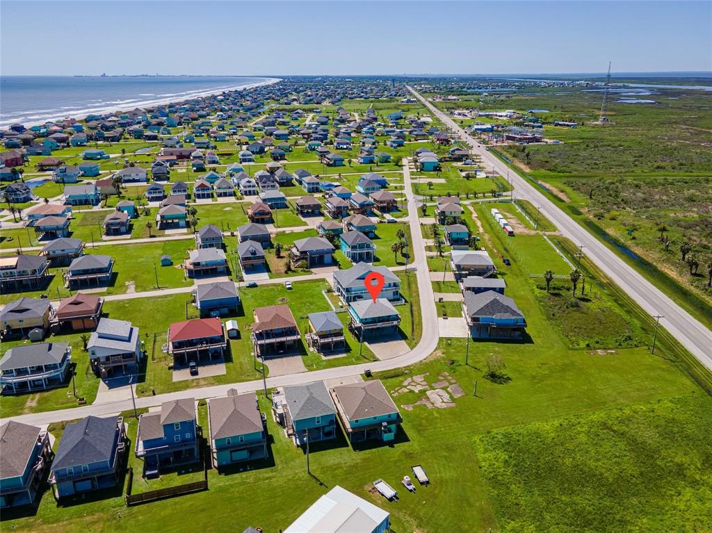 987 Surf Crystal Beach Crystal Beach, TX 77650 - Photo 45 of 45 a aerial view of multiple houses with yard
