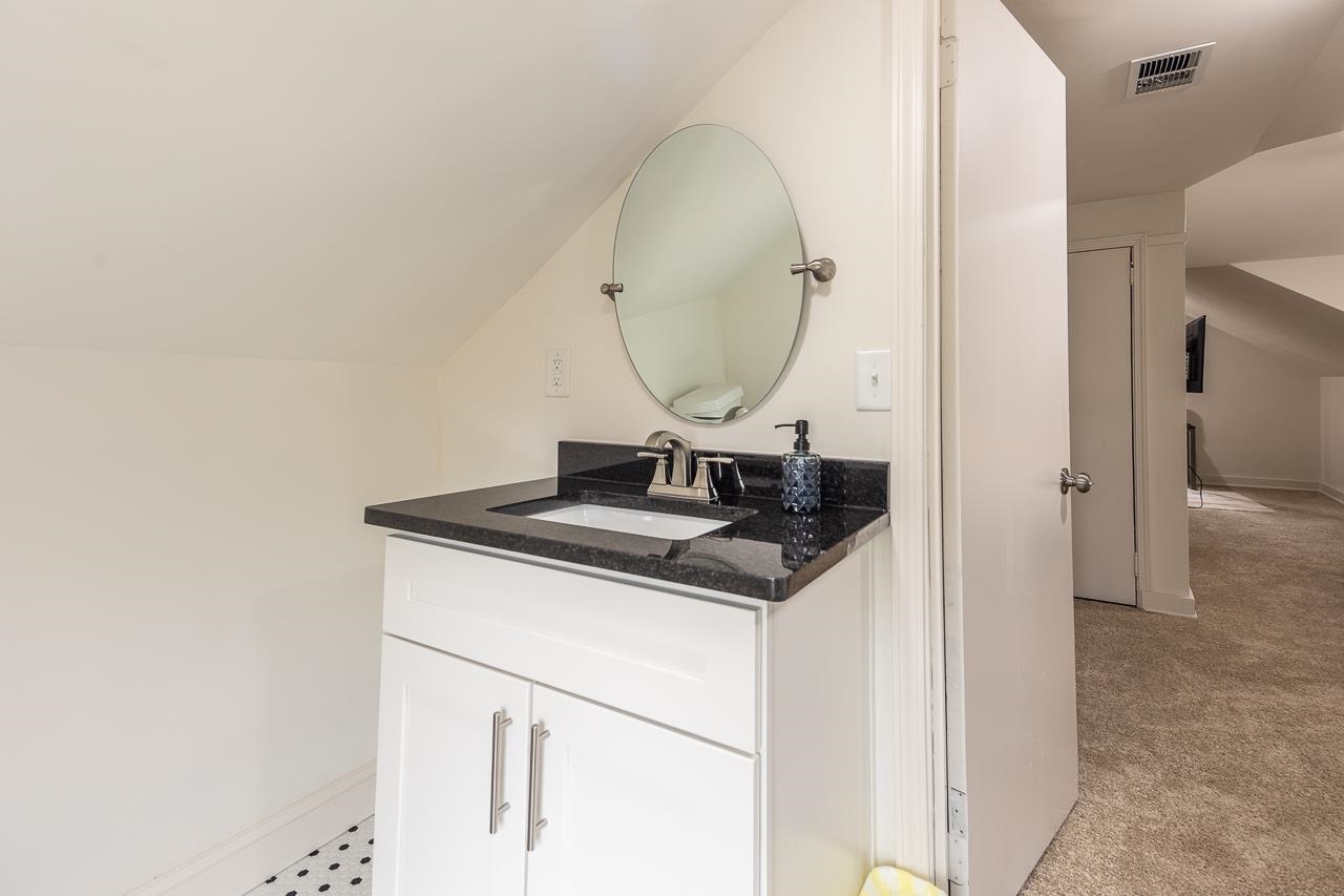 8 South Ashlawn Road Memphis, TN 38112 - Photo 16 of 23 a sink and a mirror