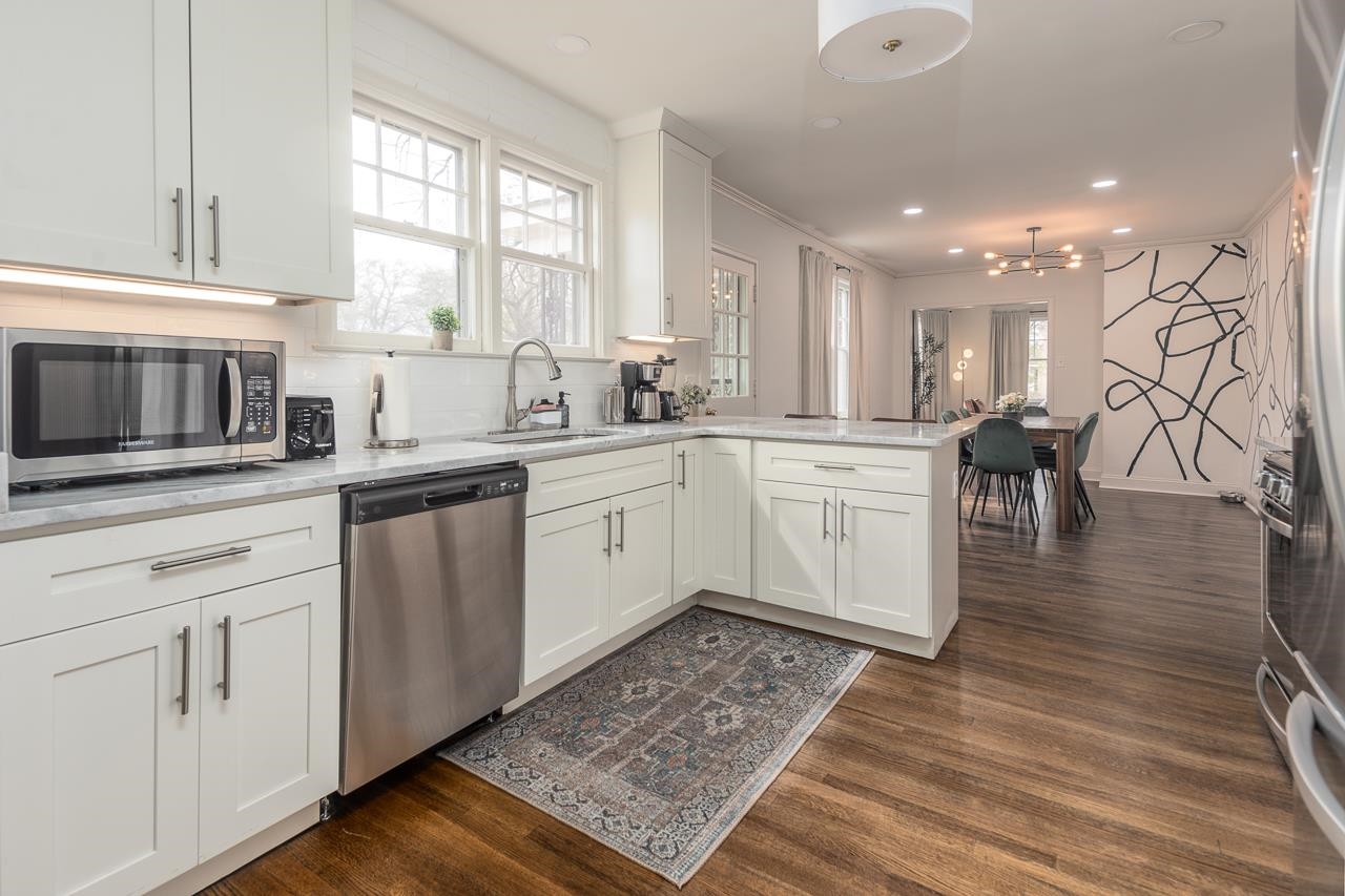 8 South Ashlawn Road Memphis, TN 38112 - Photo 7 of 23 a kitchen with a sink cabinets and wooden floor