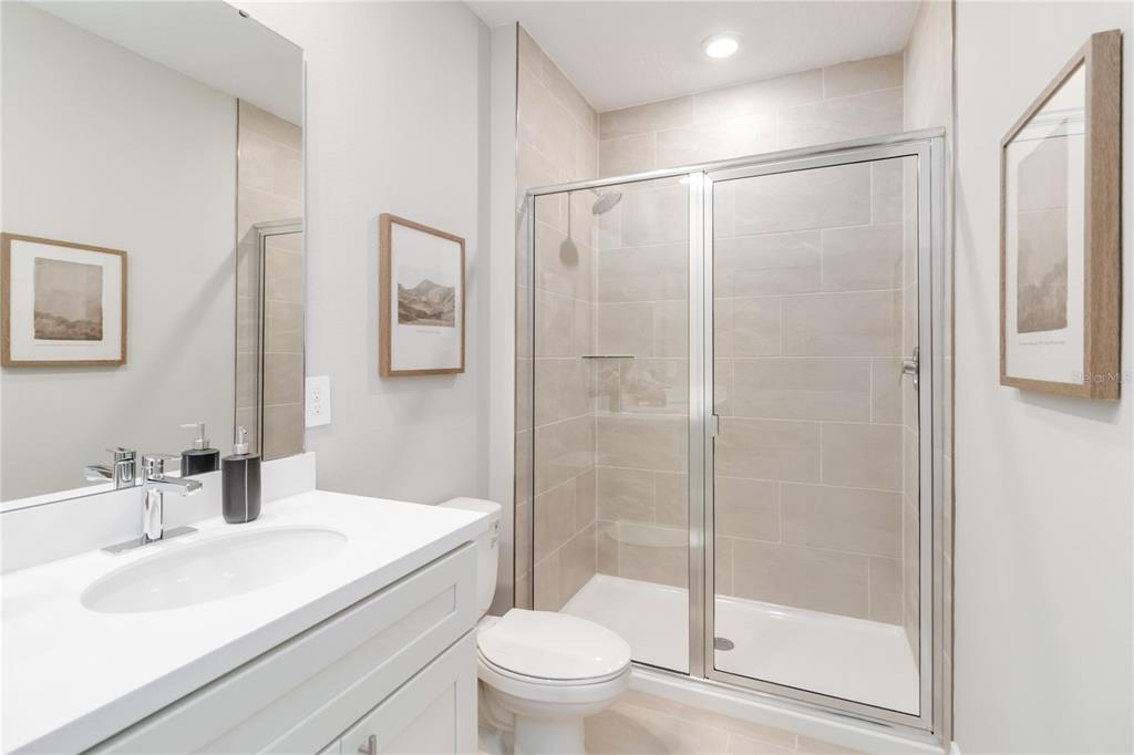 1109 Orange Trailside Way Ocoee, FL 34761 - Photo 20 of 32 a bathroom with a sink toilet and shower