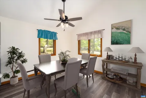 a view of a dining room with furniture window and wooden floor