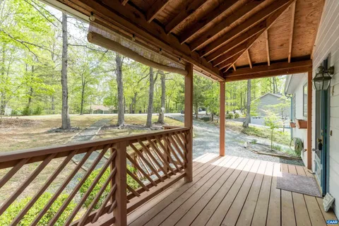 a view of balcony with wooden floor