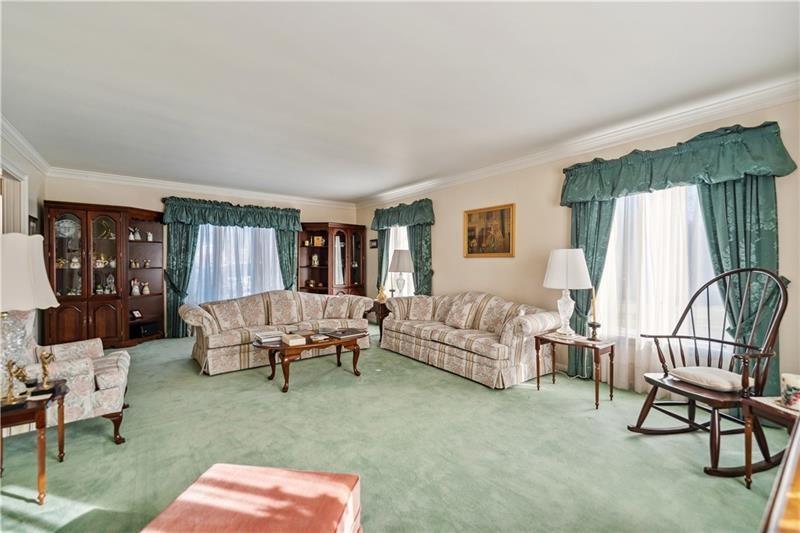 229 Crawford Lane Rostraver Township, PA 15012 - Photo 11 of 48 a living room with furniture and a couch