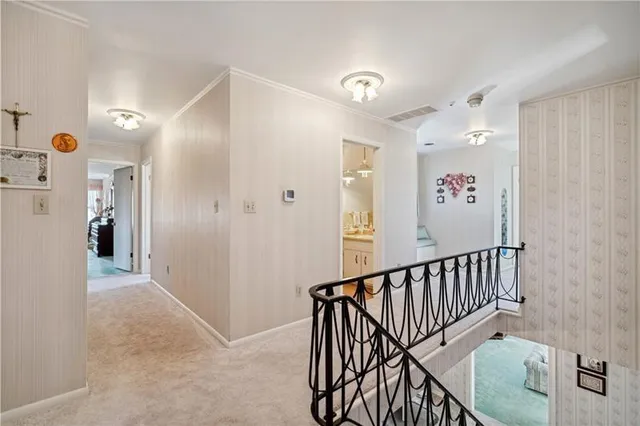 a view of a hallway with entryway door