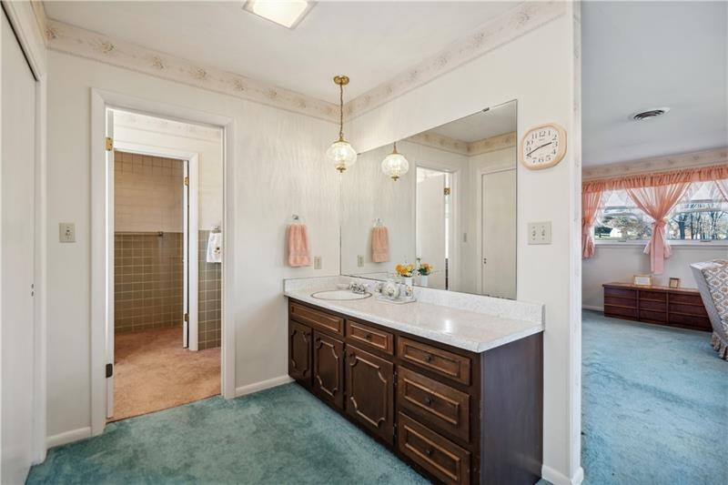 229 Crawford Lane Rostraver Township, PA 15012 - Photo 28 of 48 a spacious bathroom with a sink a vanity and a mirror