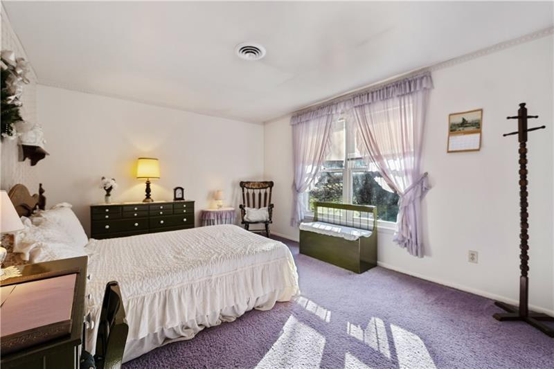 229 Crawford Lane Rostraver Township, PA 15012 - Photo 38 of 48 a bedroom with a bed and a dresser