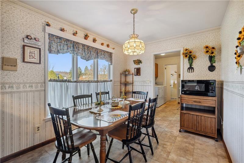 229 Crawford Lane Rostraver Township, PA 15012 - Photo 5 of 48 a view of a dining room with furniture wooden floor and chandelier
