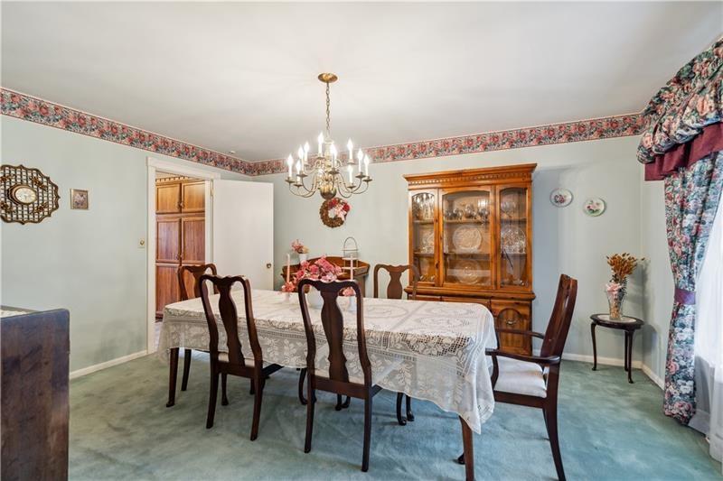 229 Crawford Lane Rostraver Township, PA 15012 - Photo 7 of 48 a view of a dining room with furniture and chandelier