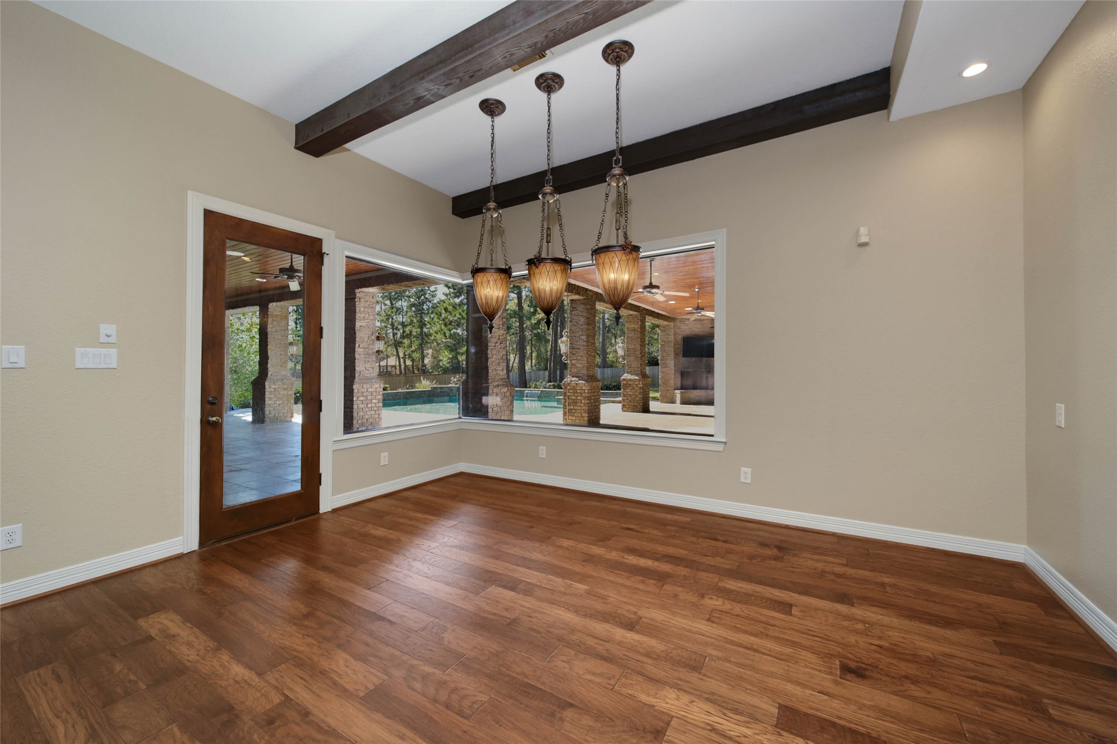 6803 Star Ledge Court Spring, TX 77389 - Photo 16 of 48 Spacious Breakfast Room with beamed ceiling with view of backyard paradise!