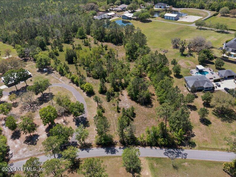 5371 Church Road St. Augustine, FL 32092 - Photo 3 of 33 an aerial view of lake residential houses with outdoor space and trees