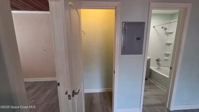 a bathroom with a granite countertop shower and a sink
