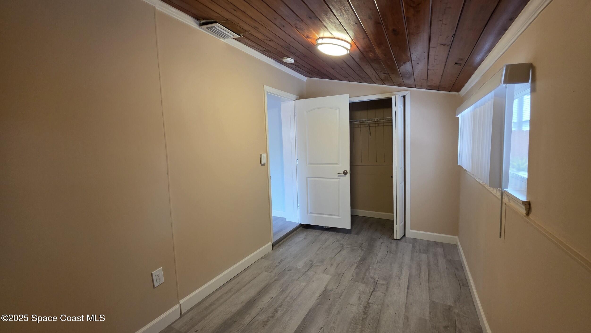 6411 Ridgewood Avenue Cocoa Beach, FL 32931 - Photo 10 of 15 a view of hallway with wooden floor