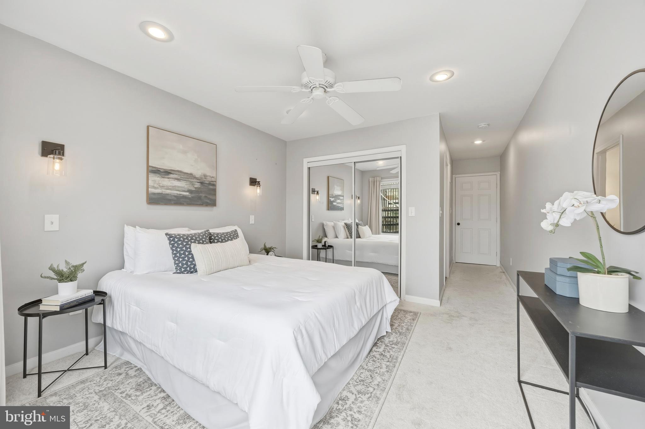 1419 Andre Street Baltimore, MD 21230 - Photo 12 of 25 a bedroom with a large bed and a chandelier