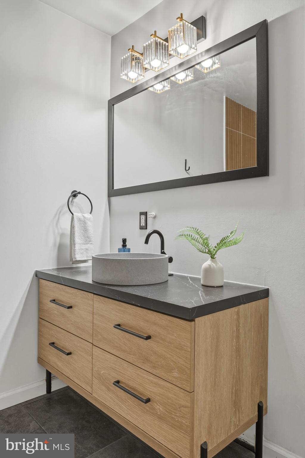 1419 Andre Street Baltimore, MD 21230 - Photo 14 of 25 a bathroom with a sink and a mirror