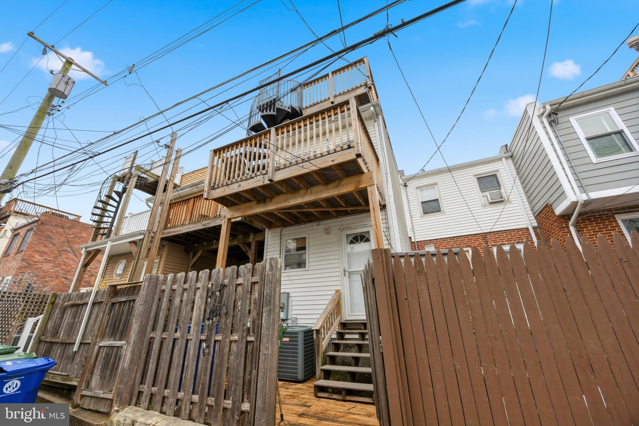 1419 Andre Street Baltimore, MD 21230 - Photo 24 of 25 a view of a house with wooden deck