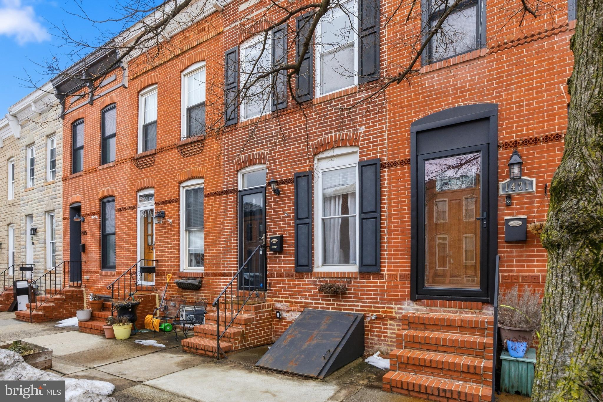 1419 Andre Street Baltimore, MD 21230 - Photo 25 of 25 a front view of a building with outdoor seating