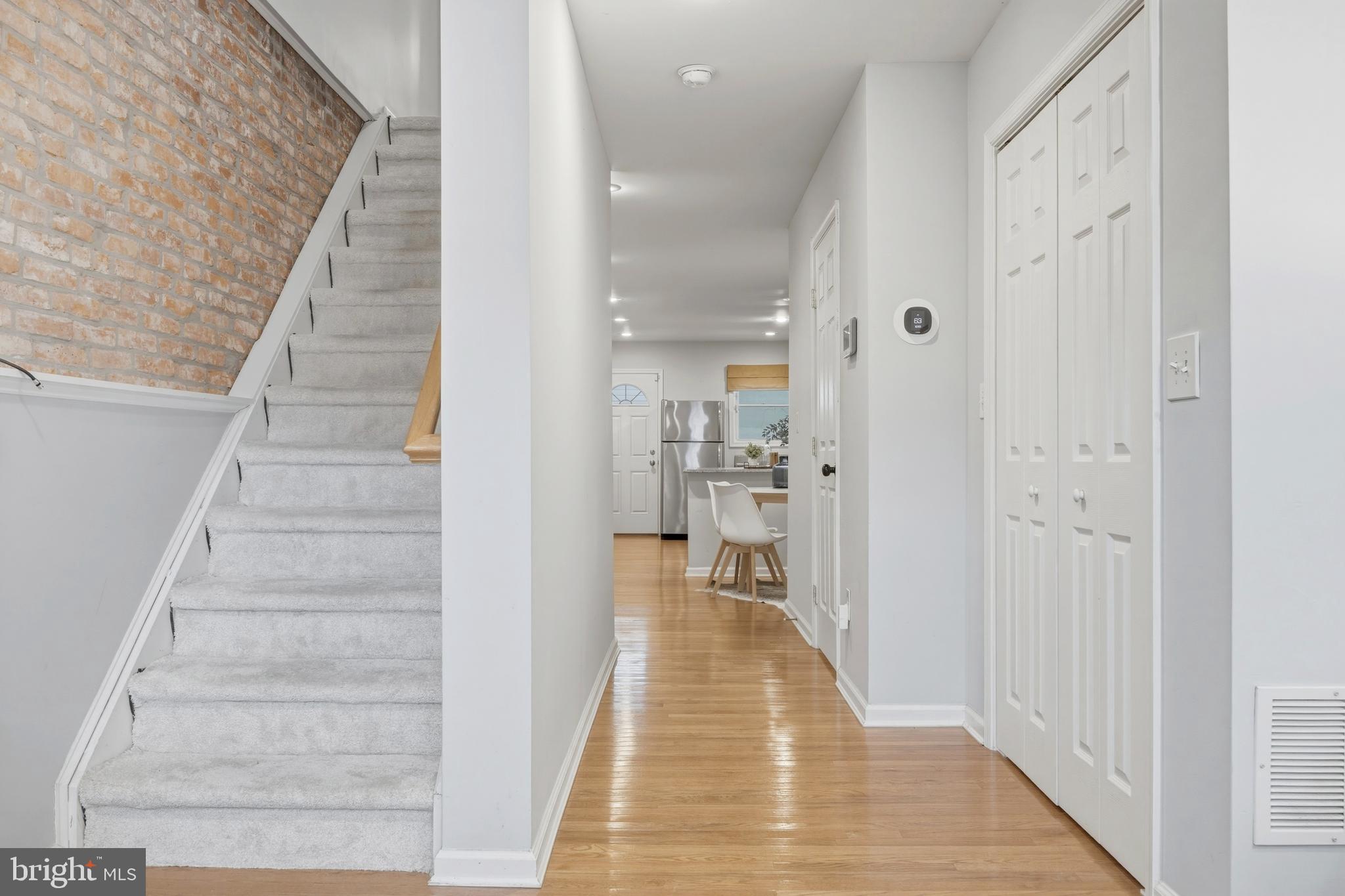 1419 Andre Street Baltimore, MD 21230 - Photo 4 of 25 a view of a hallway with wooden floor and staircase