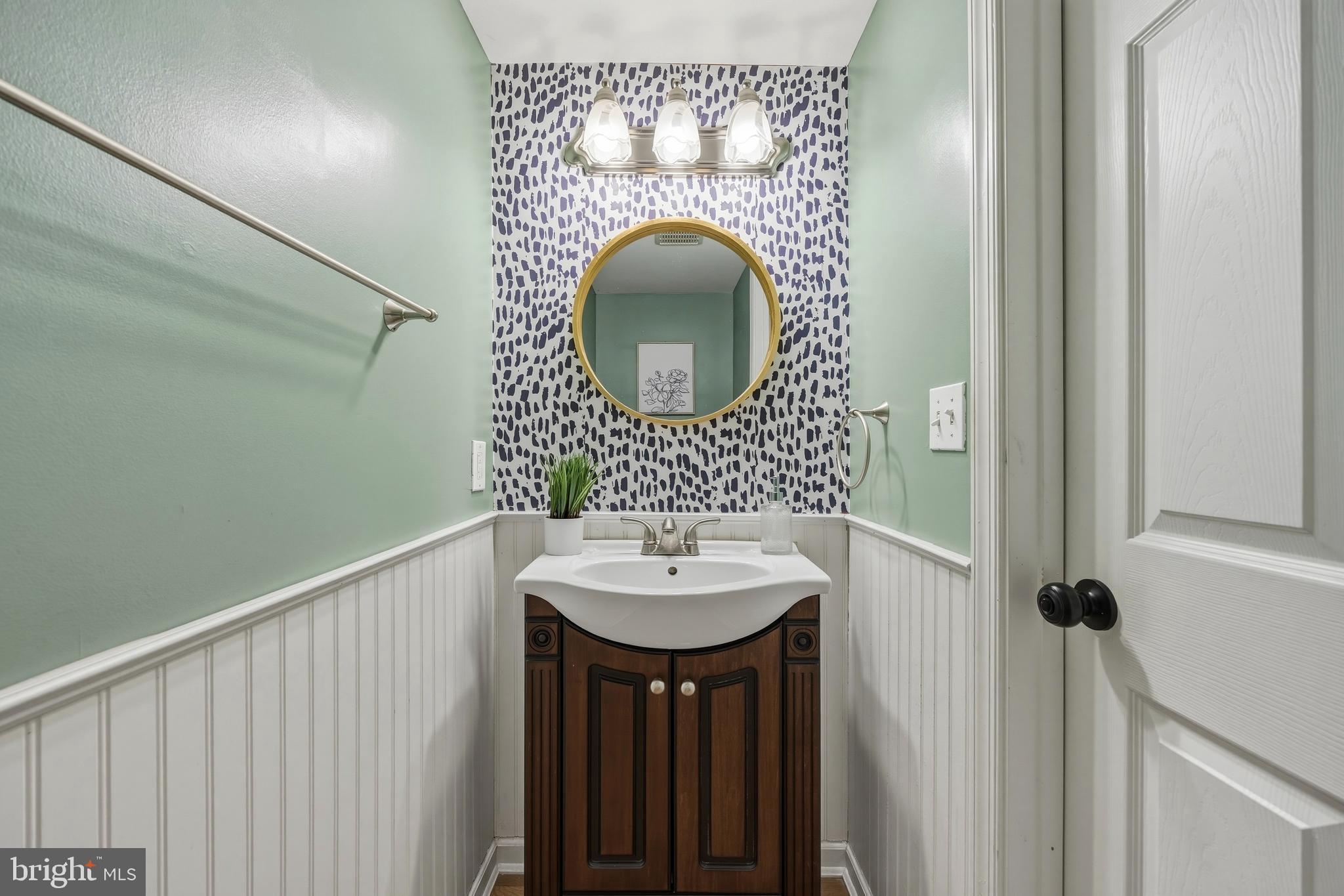 1419 Andre Street Baltimore, MD 21230 - Photo 10 of 25 a bathroom with a sink and a mirror
