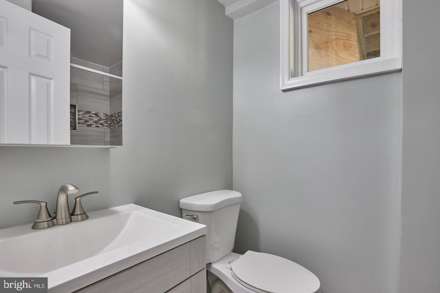 1007 Venice Drive Silver Spring, MD 20904 - Photo 29 of 39 a white toilet sitting next to a bathroom sink