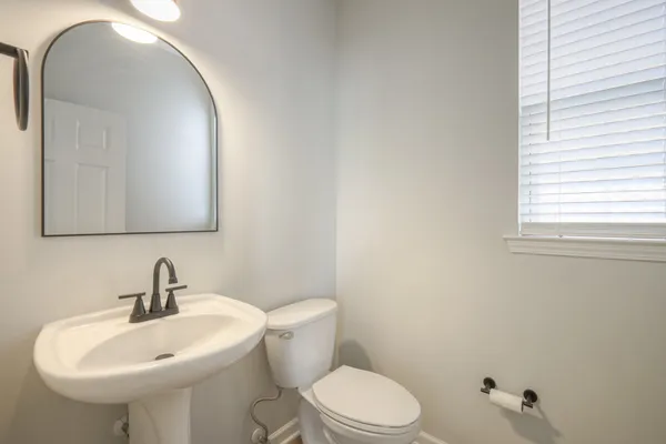 a view of a kitchen with a sink and a fireplace