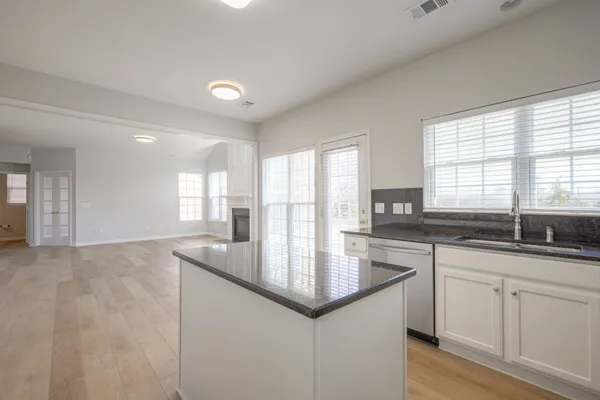 a view of a hallway with windows
