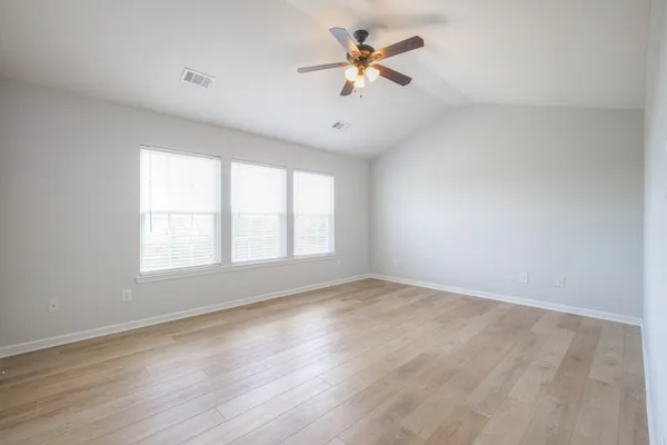 a view of empty room and wooden floor