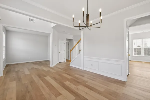 a bathroom with a sink double vanity granite tub and a mirror