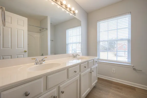 an empty room with a fan and a ceiling fan