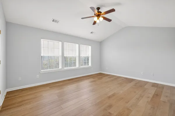 a white bath tub sitting next to a window