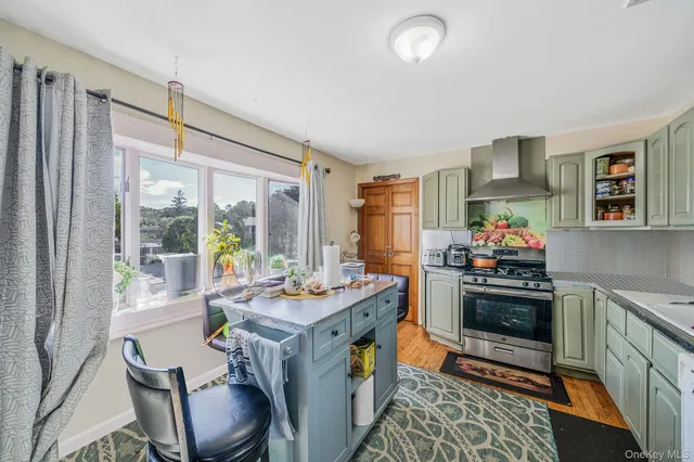 a very nice looking dining room with a large window