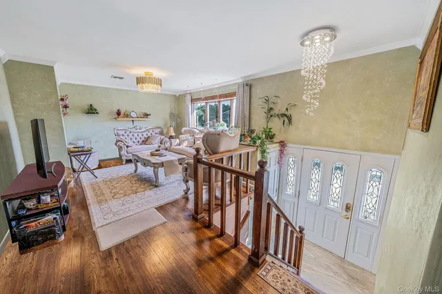 a view of a livingroom with furniture and wooden floor