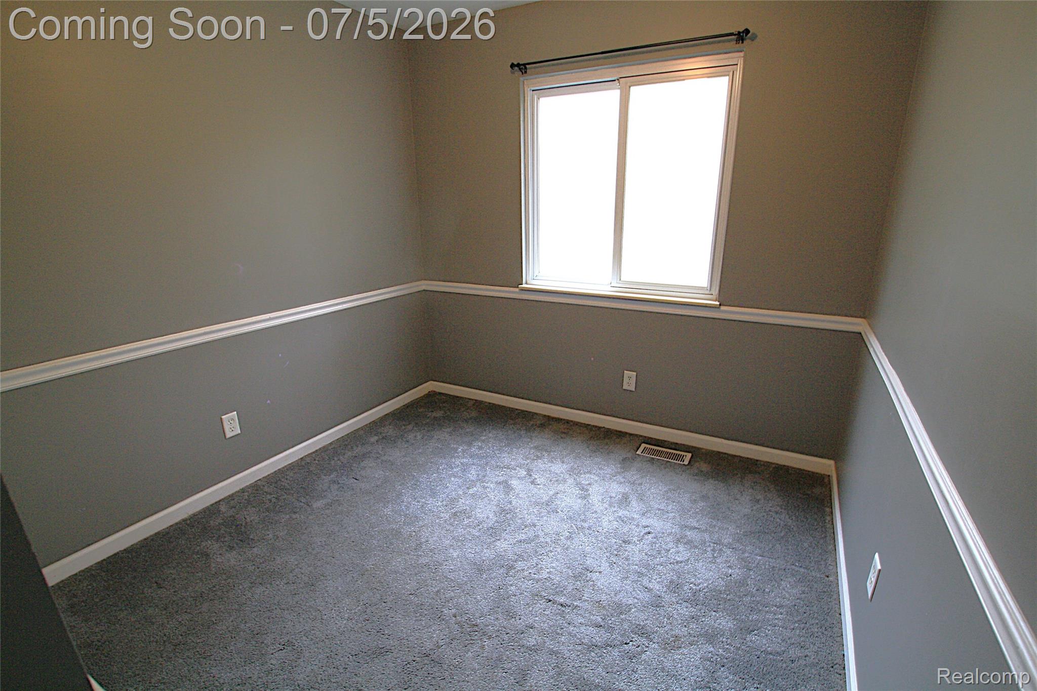 12403 Willard Road Montrose, MI 48457 - Photo 20 of 30 Spare room featuring carpet and baseboards