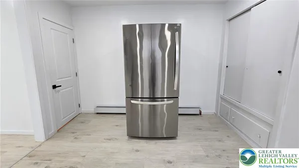 a bathroom with a glass shower door