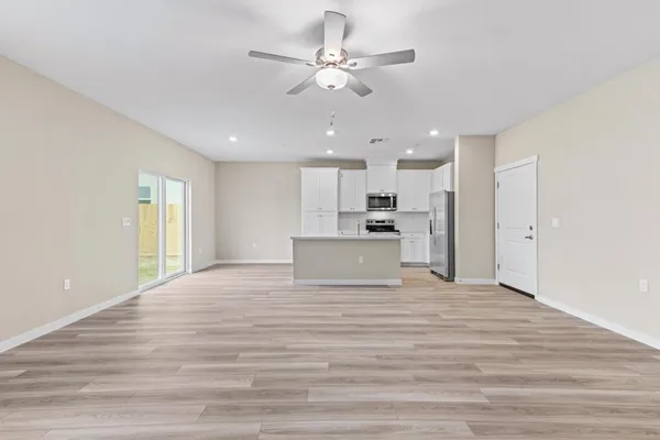 a view of kitchen with wooden floor