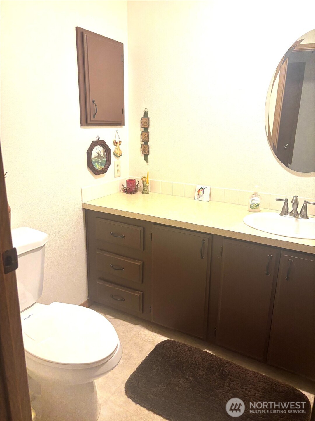 30 Marjory Lane Sequim, WA 98382 - Photo 19 of 22 a bathroom with a toilet a sink and mirror