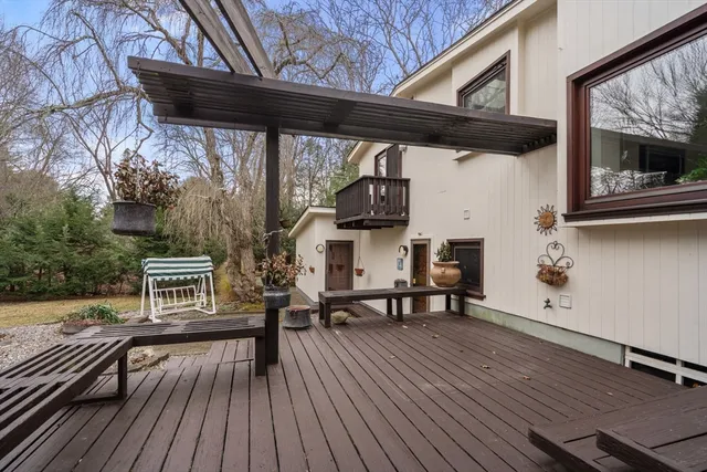 a view of outdoor seating with furniture and wooden floor