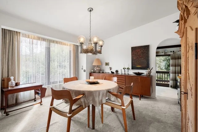 a view of a dining room with furniture window and outside view