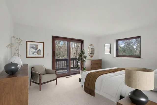 a bedroom with a large bed and a couch