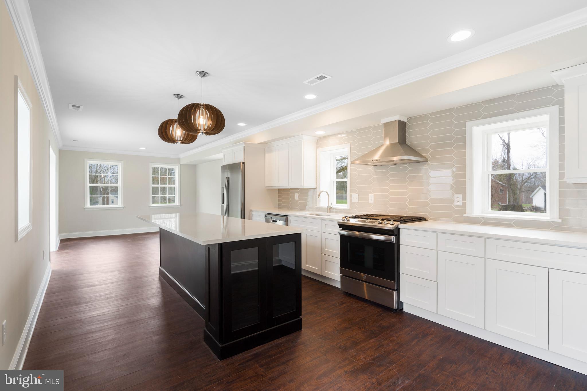 621 Beatty Road Springfield, PA 19064 - Photo 1 of 22 a kitchen with stainless steel appliances granite countertop a stove and a sink