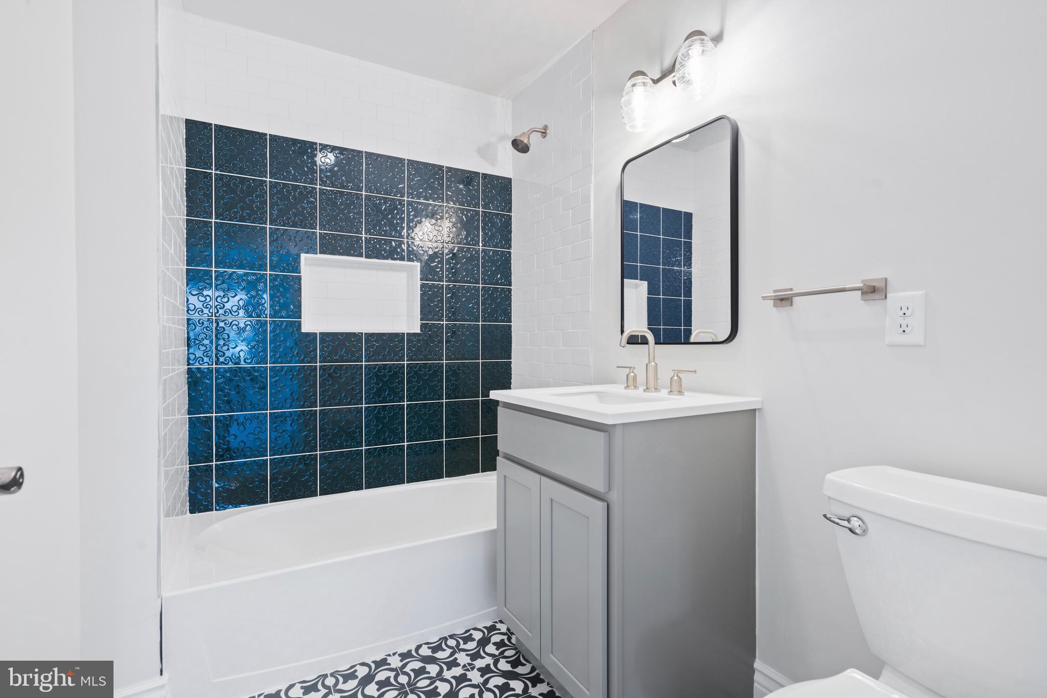 621 Beatty Road Springfield, PA 19064 - Photo 11 of 22 a bathroom with a sink toilet and shower