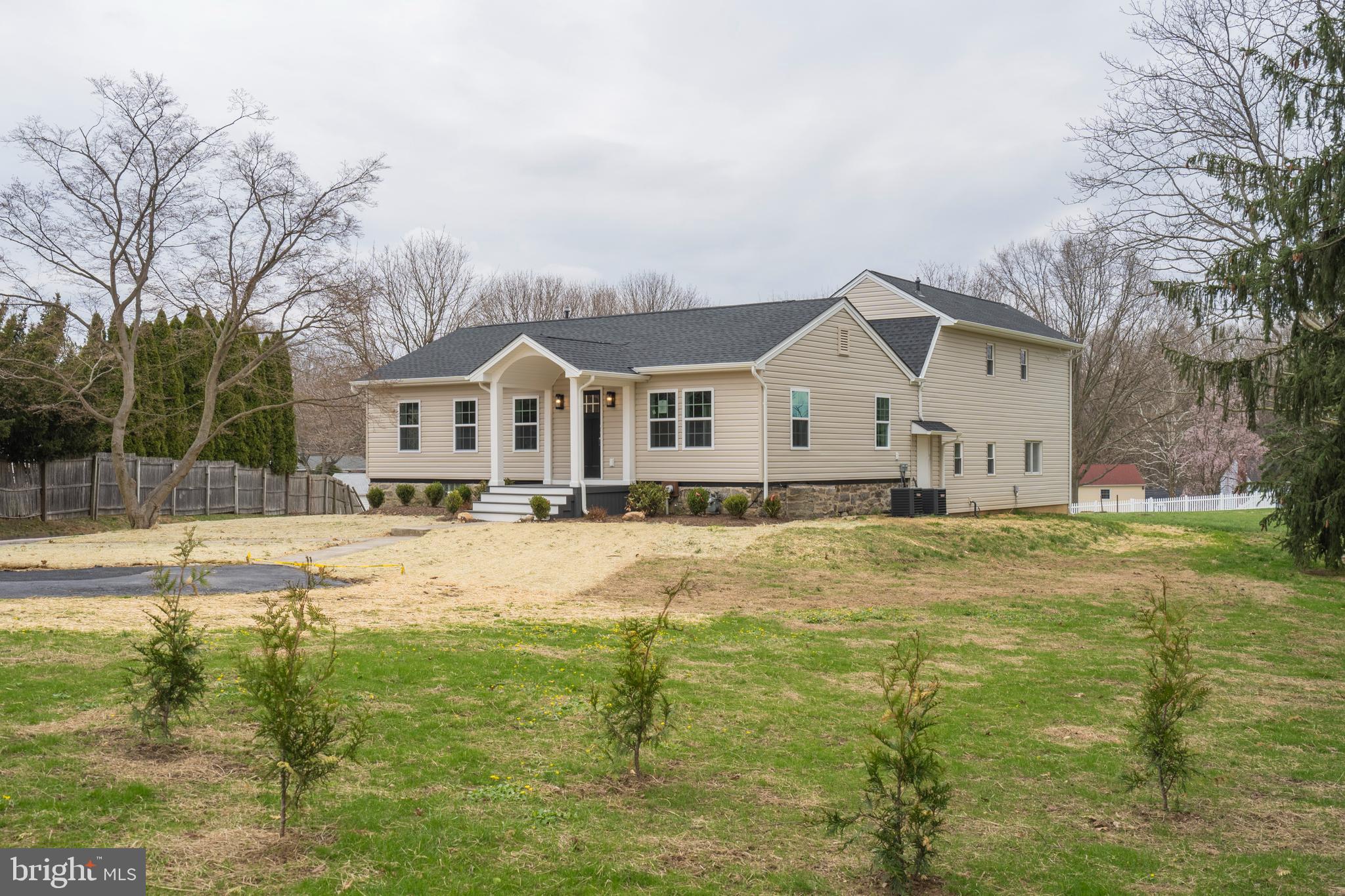 621 Beatty Road Springfield, PA 19064 - Photo 17 of 22 a view of a house with a big yard and large trees