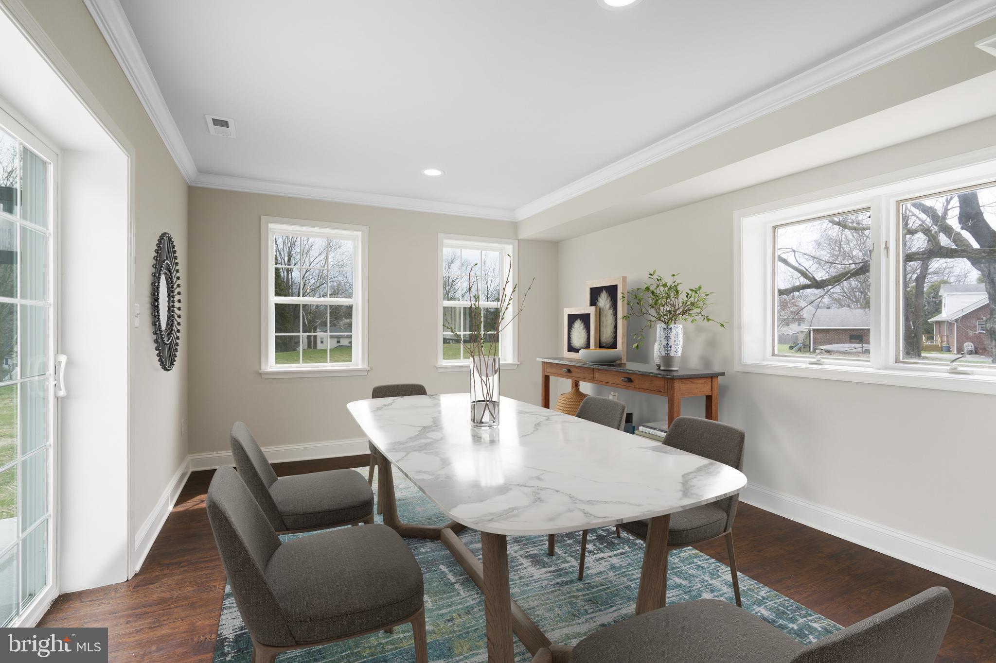 621 Beatty Road Springfield, PA 19064 - Photo 4 of 22 a view of a dining room with furniture and wooden floor